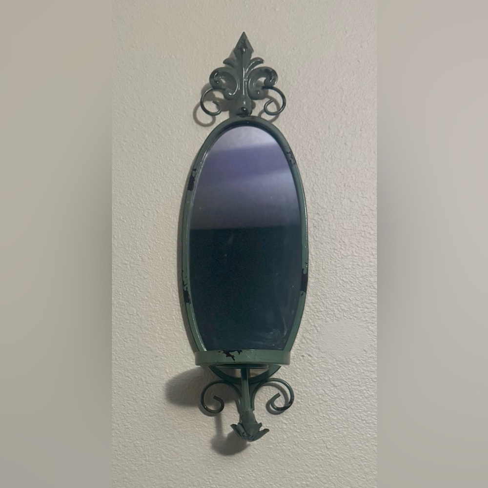 Pair of vintage metal wall mirrors with candle holders